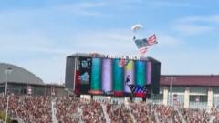 Watch: Skydiver crashes into jumbotron at US football game