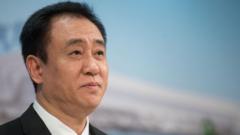 Founder of China's Evergrande pleads guilty to fraud
